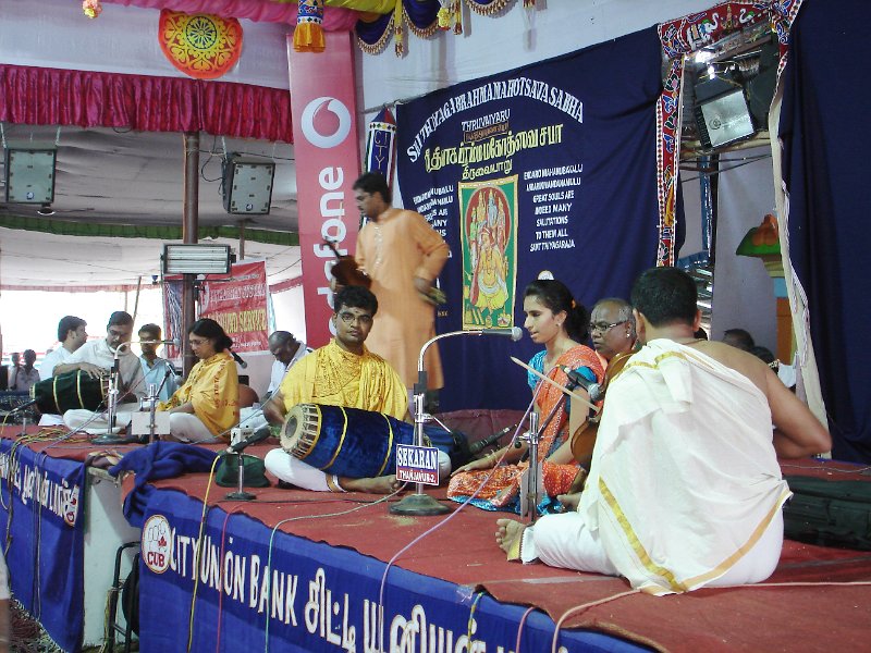 DSC03311.JPG - A youngster performs on one side of the stage as vocalist Suryaprakash prepares for his turn